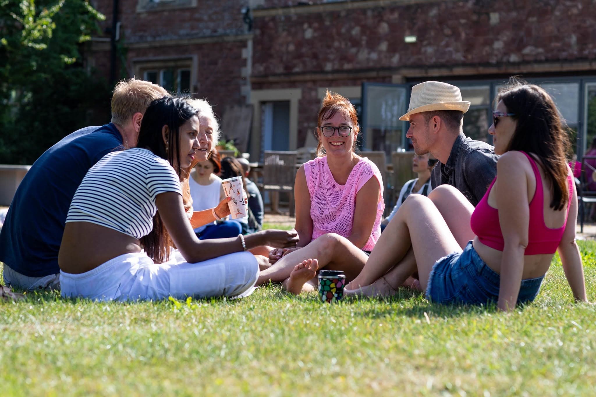 Students relaxing together in the sunshine
