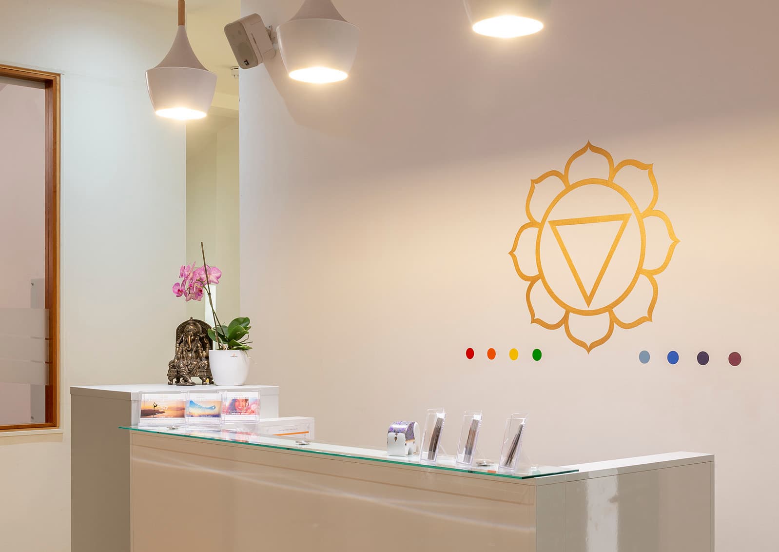 The reception desk with chakra wall art
