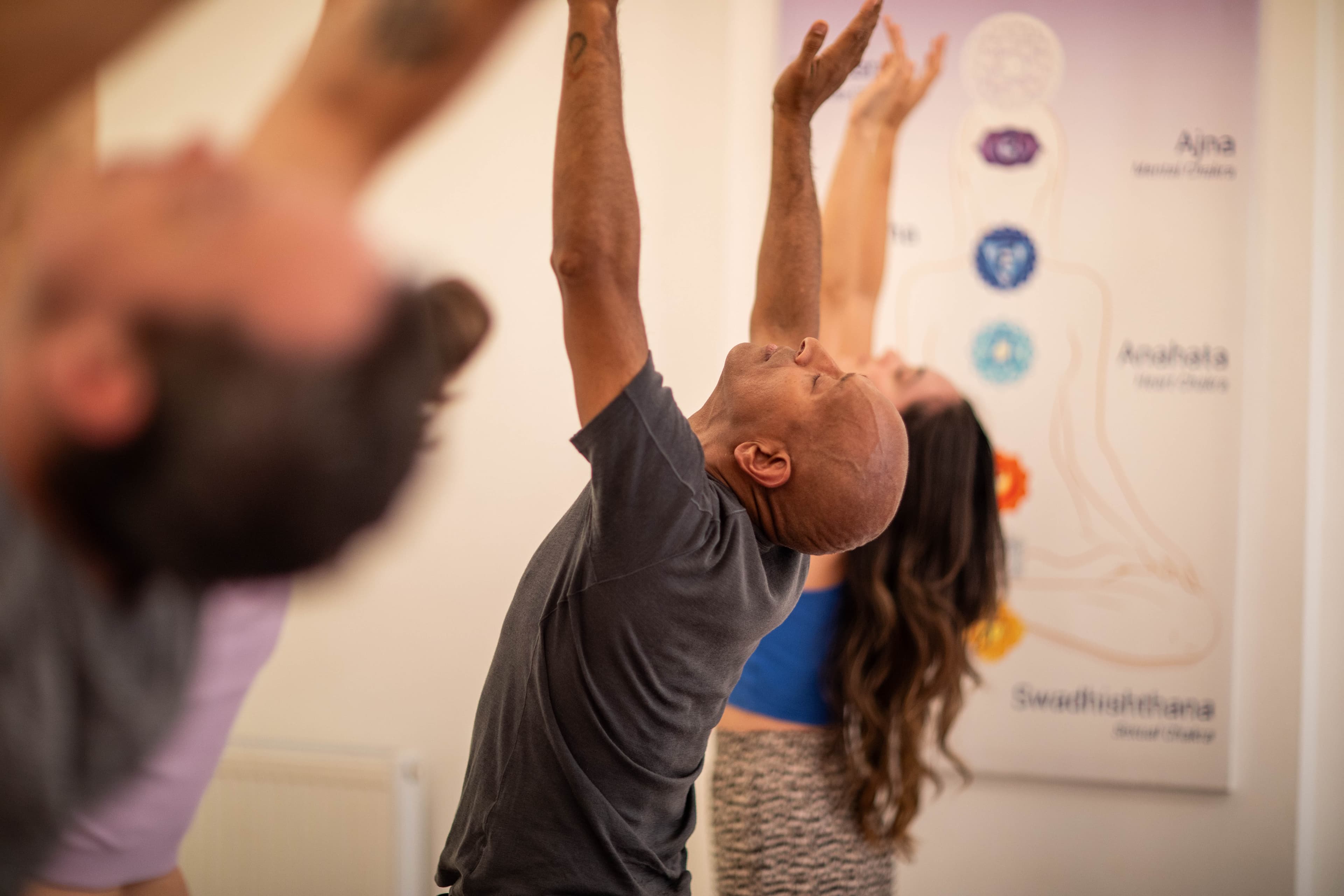 Practising yoga together at the Tara London centre