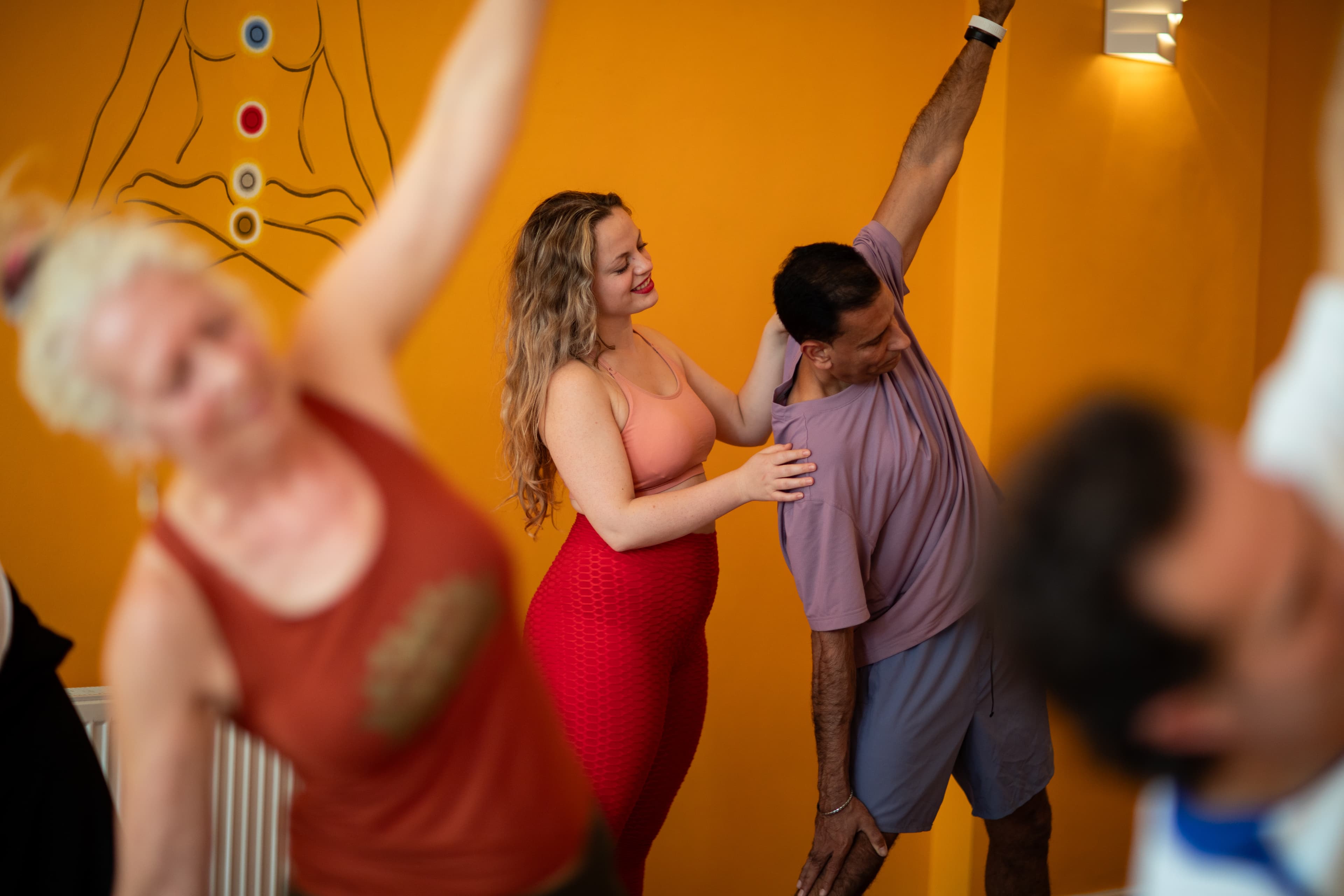 A teacher guiding a student during a class at Tara