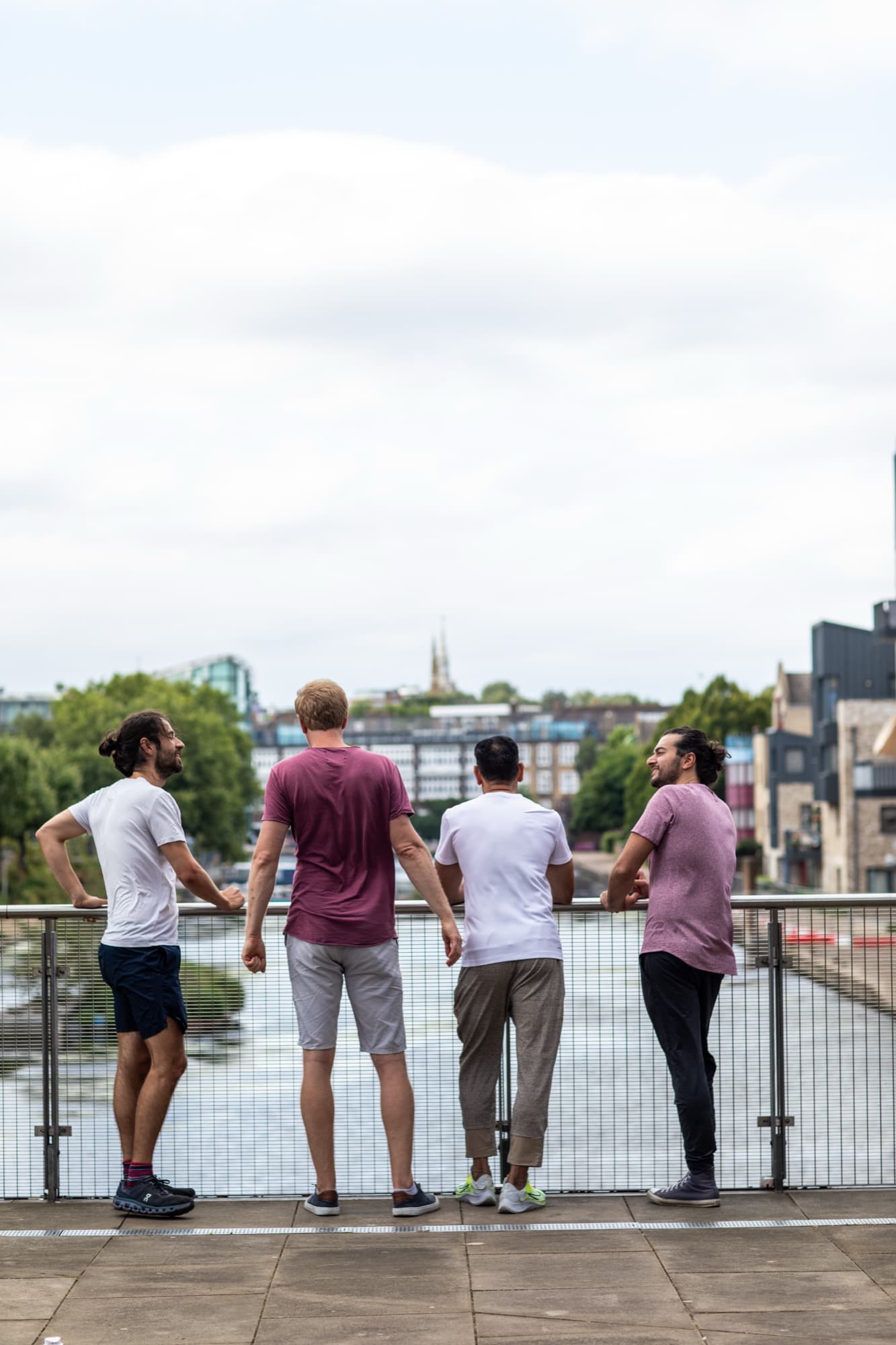 Men of the Vira group talking together overlooking the river