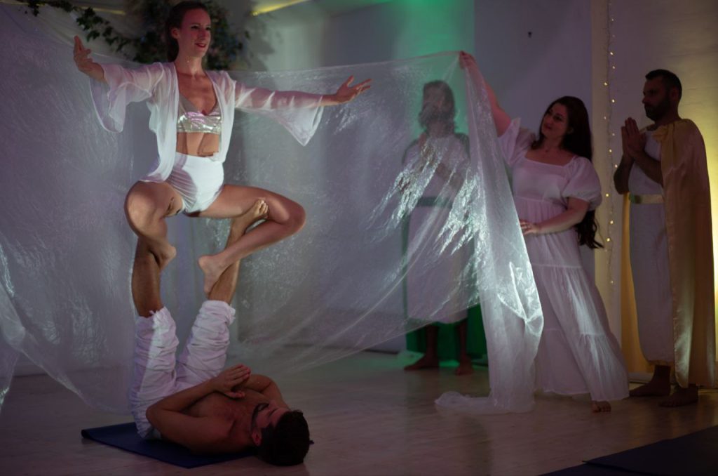Performers in white with flowing veils at an Angels & Archangels Week performance, Tara Yoga Centre